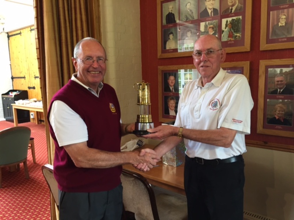 John Ketley presnting Brian Rodgers with the Miners lamp